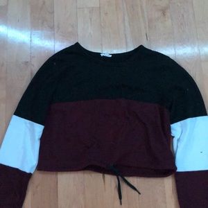 Worn crop top with long sleeves